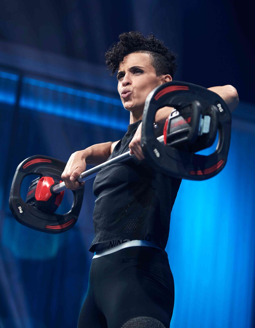Video presenter Yassi working out with a barbell